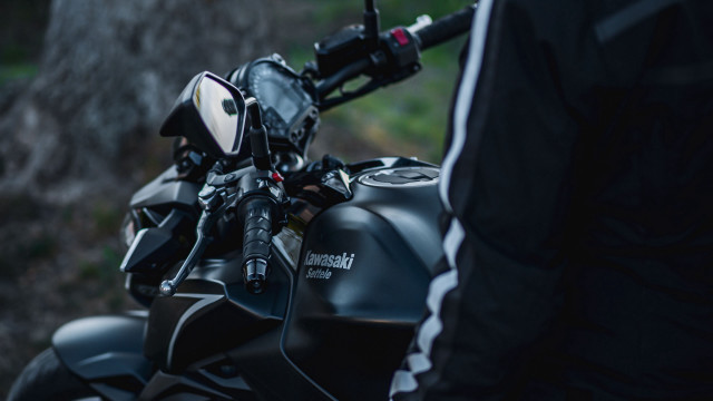 Motorcycle woods person blurry shallow free wallpaper for desktop - medium preview image