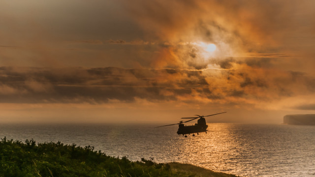 Helicopter over water cloudy sky free wallpaper for desktop - medium preview image