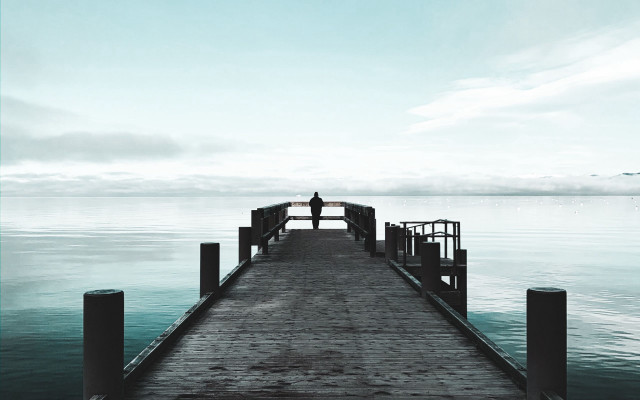 Docked person water clouds tranquil free wallpaper for desktop - medium preview image