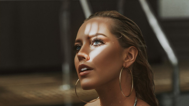 Woman hoop earrings white shirt free wallpaper for desktop - medium preview image