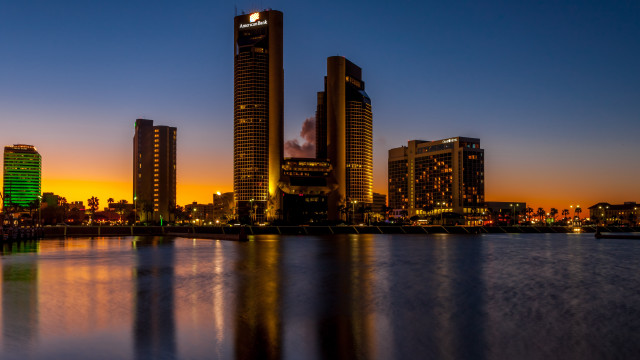 City skyline night water orange free wallpaper for desktop - medium preview image