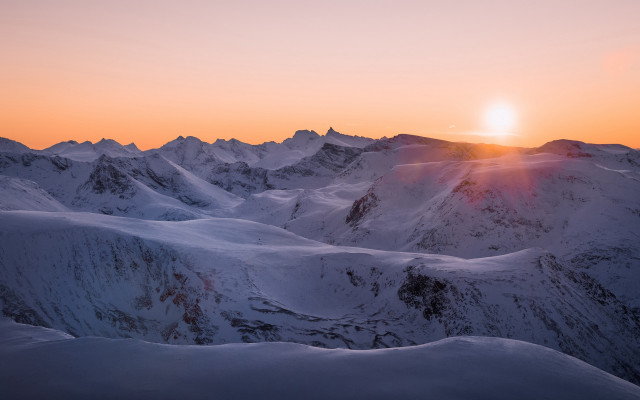 Mountain sunset skier snowy horizon free wallpaper for desktop - medium preview image