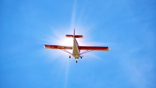 Small plane blue sky sun free wallpaper for desktop - medium preview image