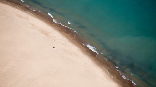 Beach sandy shore lone person free wallpaper for desktop - medium preview image