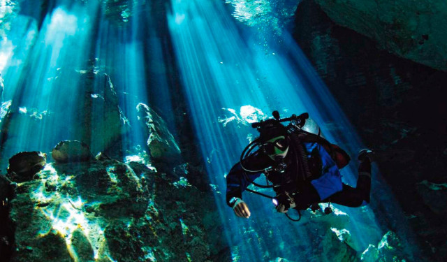 Scuba diver cave sunlight water free wallpaper for desktop - medium preview image
