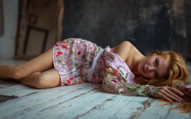 Young woman laying blurry floral free wallpaper for desktop - medium preview image