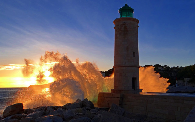 Lighthouse wave sunset ocean impressionist free wallpaper for desktop - medium preview image