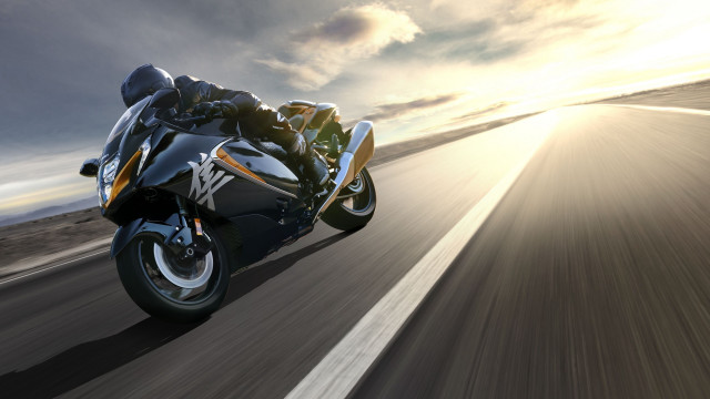 Motorcycle sunlight road blurry background free wallpaper for desktop - medium preview image