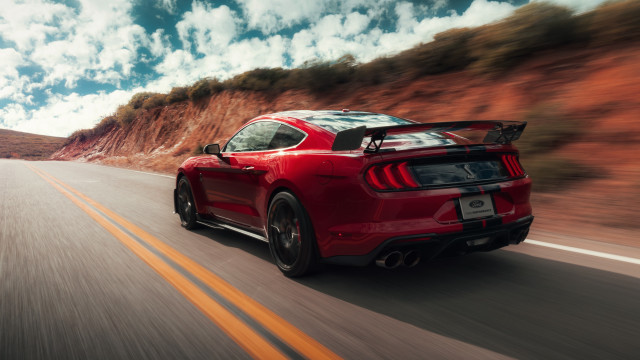 Red mustang mountain road clouds free wallpaper for desktop - medium preview image