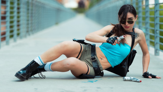 Woman blue top black shorts free wallpaper for desktop - medium preview image