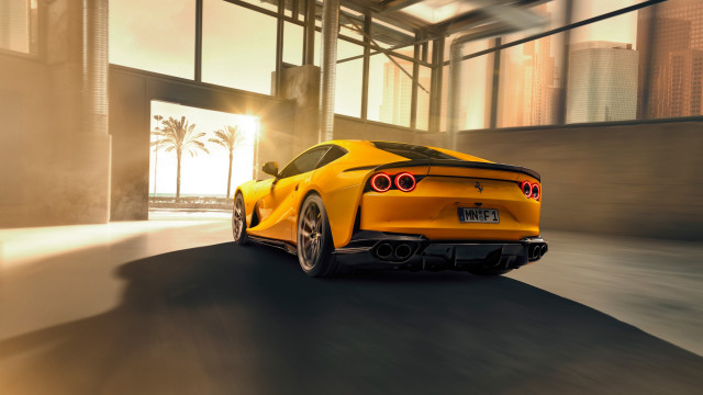 Yellow sports car city sunset free wallpaper for desktop - medium preview image