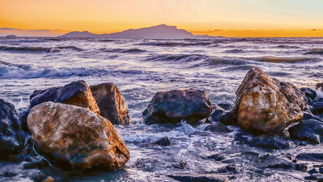 Rocks beach ocean sunset mountain free wallpaper for desktop - medium preview image