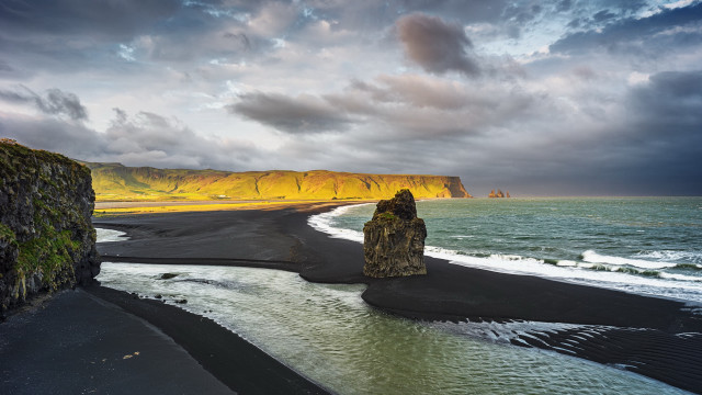 Black sand beach rock formation free wallpaper for desktop - medium preview image