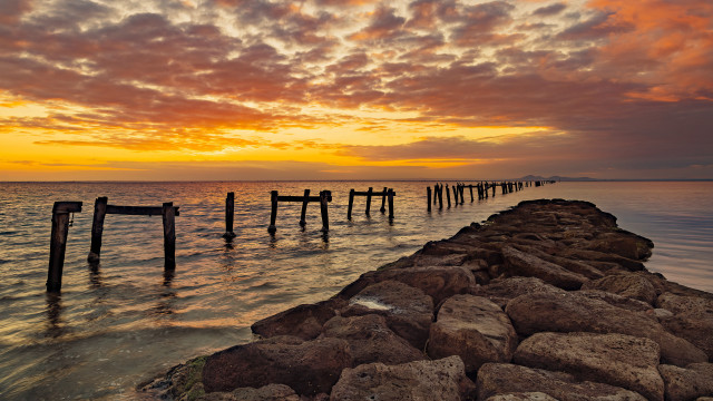 Pier rocky beach sunset boats free wallpaper for desktop - medium preview image