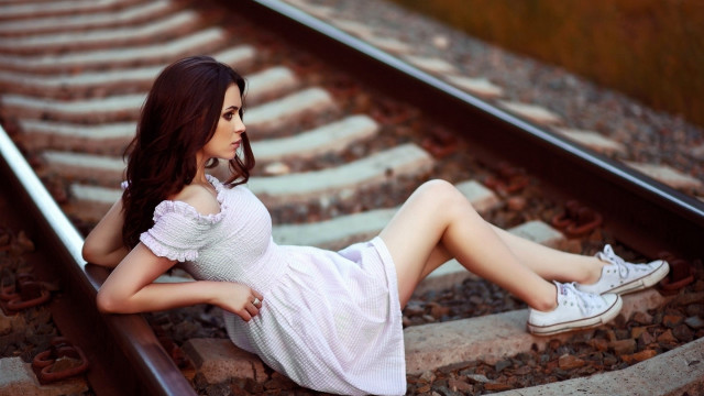 Woman sitting train track fashion free wallpaper for desktop - medium preview image