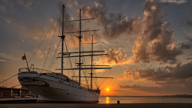 Large boat sunset clouds mountains free wallpaper for desktop - medium preview image