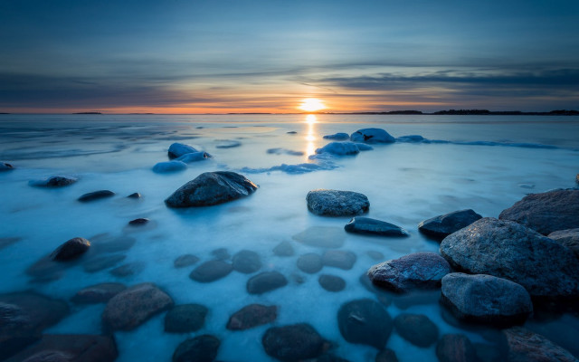 Sunset water rocks beach horizon free wallpaper for desktop - medium preview image