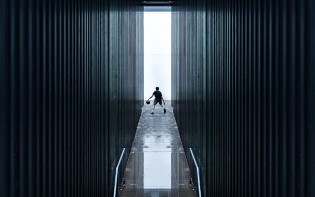 Man walking hallway suitcases window free wallpaper for desktop - medium preview image