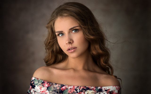 Woman floral top serious portrait free wallpaper for desktop - medium preview image