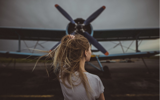 Girl airplane longhair blurry cinematic free wallpaper for desktop - medium preview image