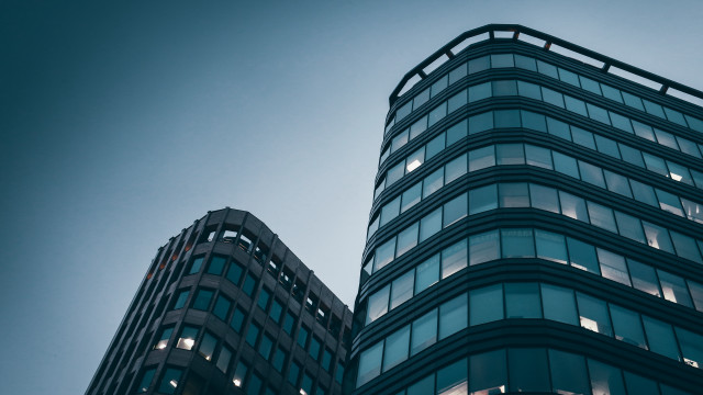 Tall building clock sky brutalism free wallpaper for desktop - medium preview image