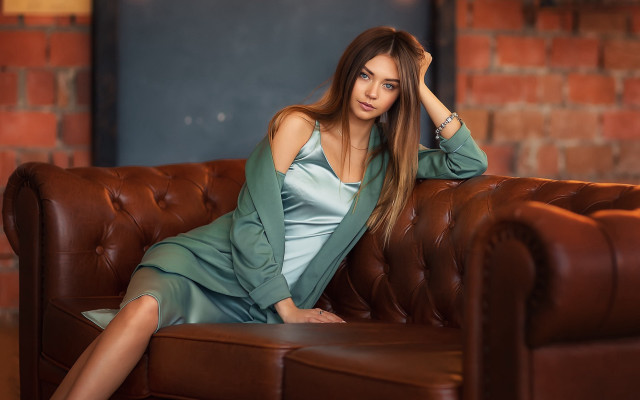 Woman green dress couch brick #2 free wallpaper for desktop - medium preview image