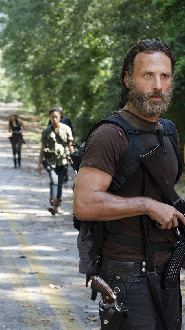 Bearded man gun walking road free wallpaper for mobile - medium preview image