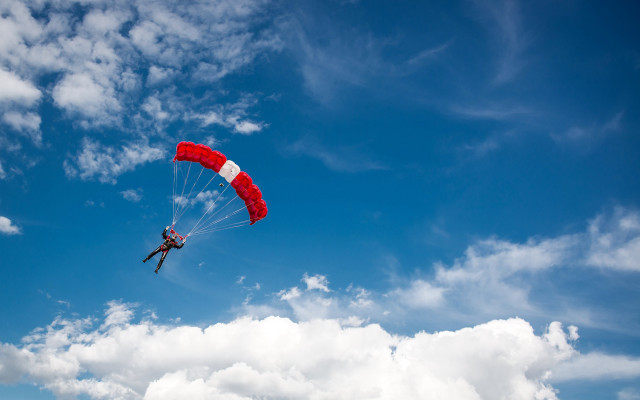 Paragliding cloudy day red parachute free wallpaper for desktop - medium preview image