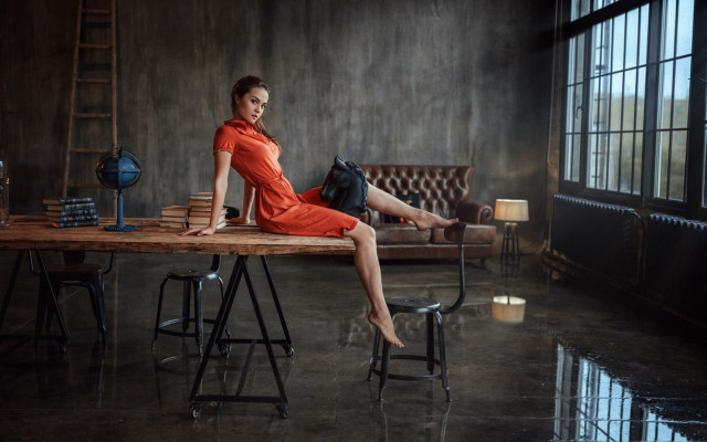Woman orange dress sitting table free wallpaper for desktop - medium preview image