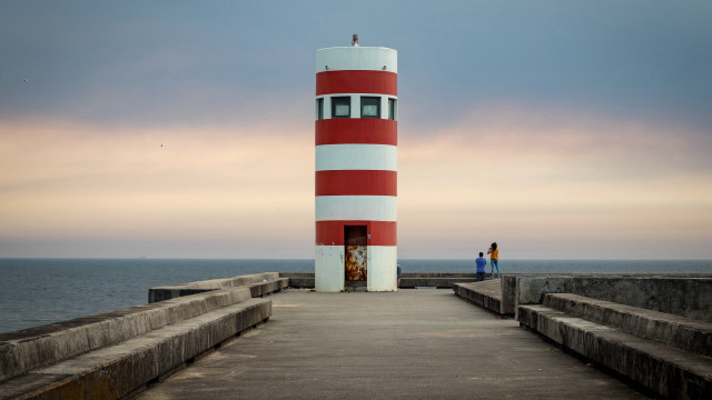 Lighthouse pier ocean solo cloudy free wallpaper for desktop - medium preview image