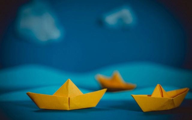 Yellow paper boat blue surface free wallpaper for desktop - medium preview image