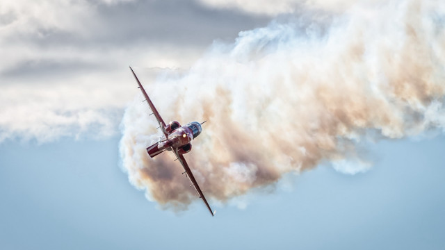 Small plane cloudy sky smoke free wallpaper for desktop - medium preview image