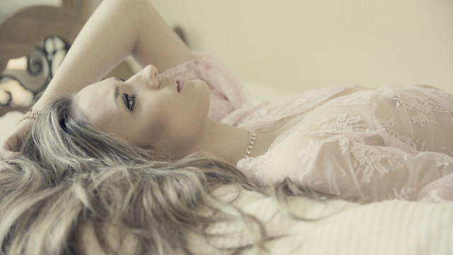 Woman laying bed hair blowing free wallpaper for desktop - medium preview image