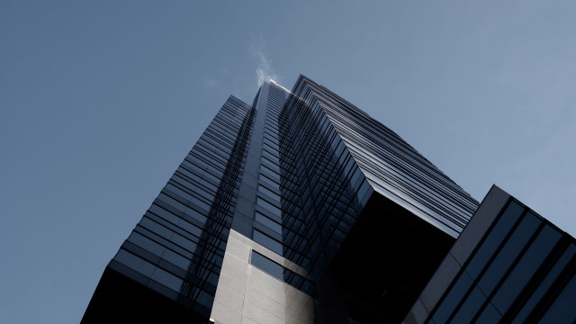 Tall building sky clouds tiltshift free wallpaper for desktop - medium preview image