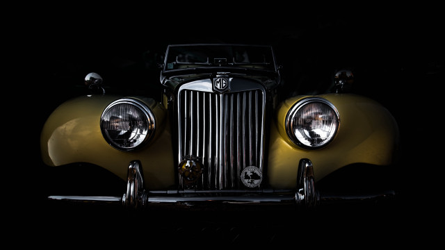 Yellow car headlights dark photorealism free wallpaper for desktop - medium preview image
