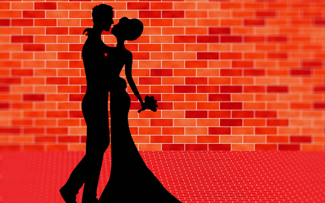 Couple kissing silhouette brick wall free wallpaper for desktop - medium preview image