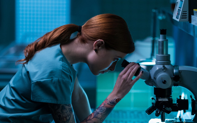 Woman microscope background holding jewelry free wallpaper for desktop - medium preview image