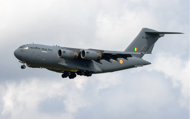 Military plane cloudy sky landing free wallpaper for desktop - medium preview image