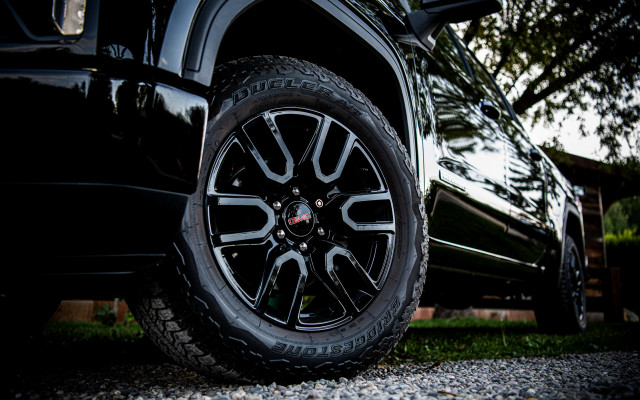 Black truck tire trees building free wallpaper for desktop - medium preview image