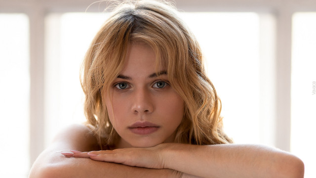 Woman crossed arms serious portrait free wallpaper for desktop - medium preview image