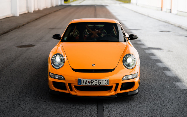 Yellow car street white building free wallpaper for desktop - medium preview image