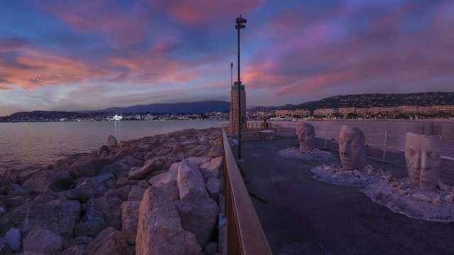 Sunset beach statues cityscape surrealist free wallpaper for desktop - medium preview image