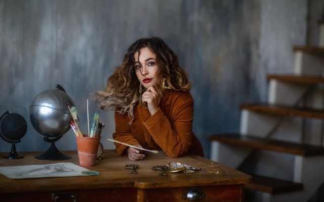 Woman sitting desk pen globe free wallpaper for desktop - medium preview image