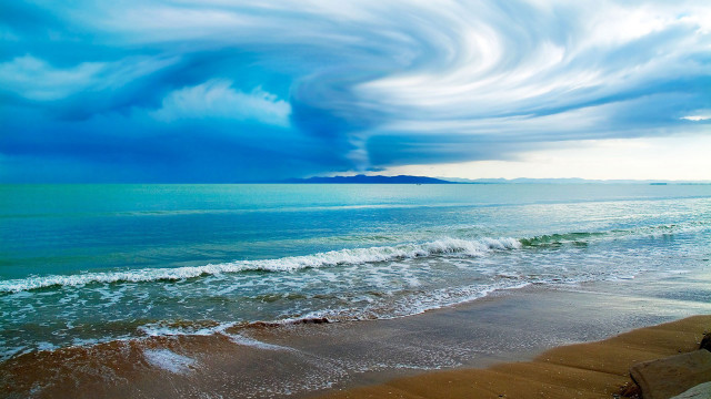 Large cloud ocean beach area free wallpaper for desktop - medium preview image