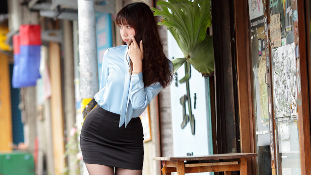 Woman skirt cellphone storefront bench free wallpaper for desktop - medium preview image