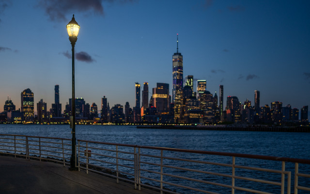 City skyline night pier lamp free wallpaper for desktop - medium preview image