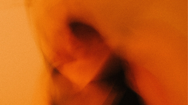 Blurry person black shirt yellow free wallpaper for desktop - medium preview image