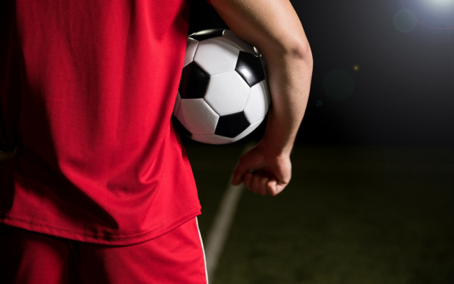 Soccer player spotlight night field free wallpaper for desktop - medium preview image