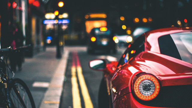 Red sports car street bokeh free wallpaper for desktop - medium preview image