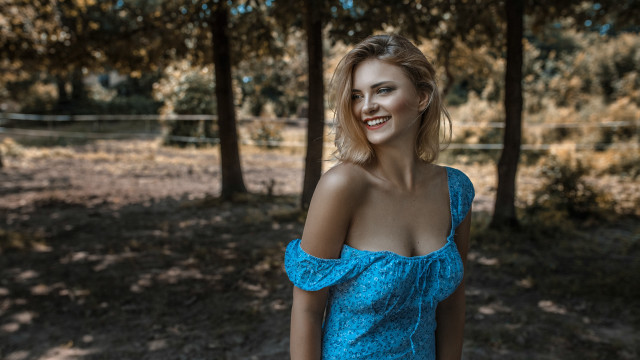 Woman blue dress wooded outdoors free wallpaper for desktop - medium preview image